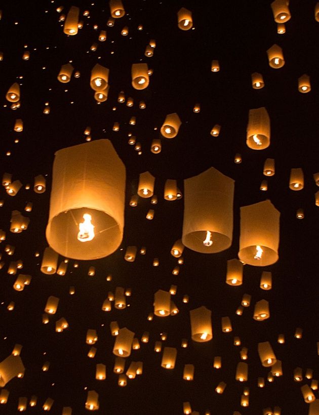 CHIANG MAI, THAILAND - OCTOBER 25: After a prayer, a synchronized lantern release occurs at the Lanna Dhutanka Temple on October 25, 2014 in Chiang Mai, Thailand. The Lanna Kathina Ceremony takes place around the Loy Krathong and Yi Peng holidays each year and marks the end of Buddhist lent when monks are offered new robes. (Photo by Taylor Weidman/Getty Images)