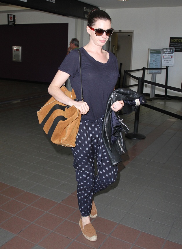 Anne Hathaway looks disappointed upon her arrival in Los Angeles. The Oscar winning actress is spotted at LAX wearing pajama pants.