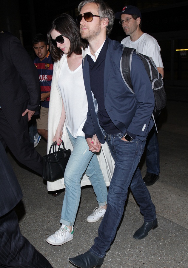 Anne Hathaway seen hand-in-hand with husband Adam Shulman returning to the USA at LAX airport