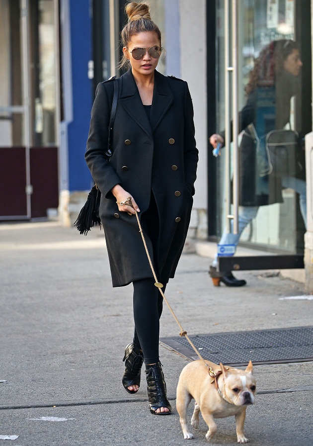 Chrissy Teigen takes her french bulldog 'Pippa' for an afternoon stroll through Soho, NYC