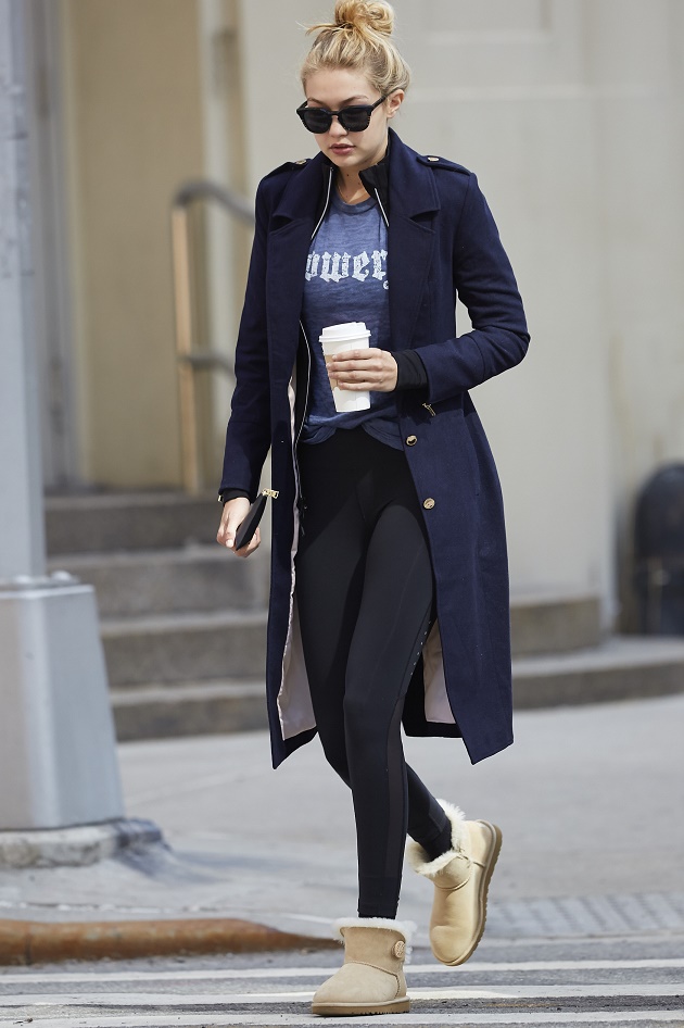 Gigi Hadid seen wearing a military inspired jacket and blue shirt while on a coffee run in the West Village neighborhood of NYC