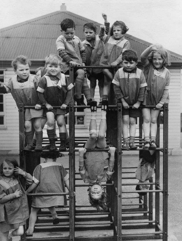 24th April 1939: Playtime for children on a climbing frame at Swansea Open Air Nursery School. (Photo by Parker/Fox Photos/Getty Images)