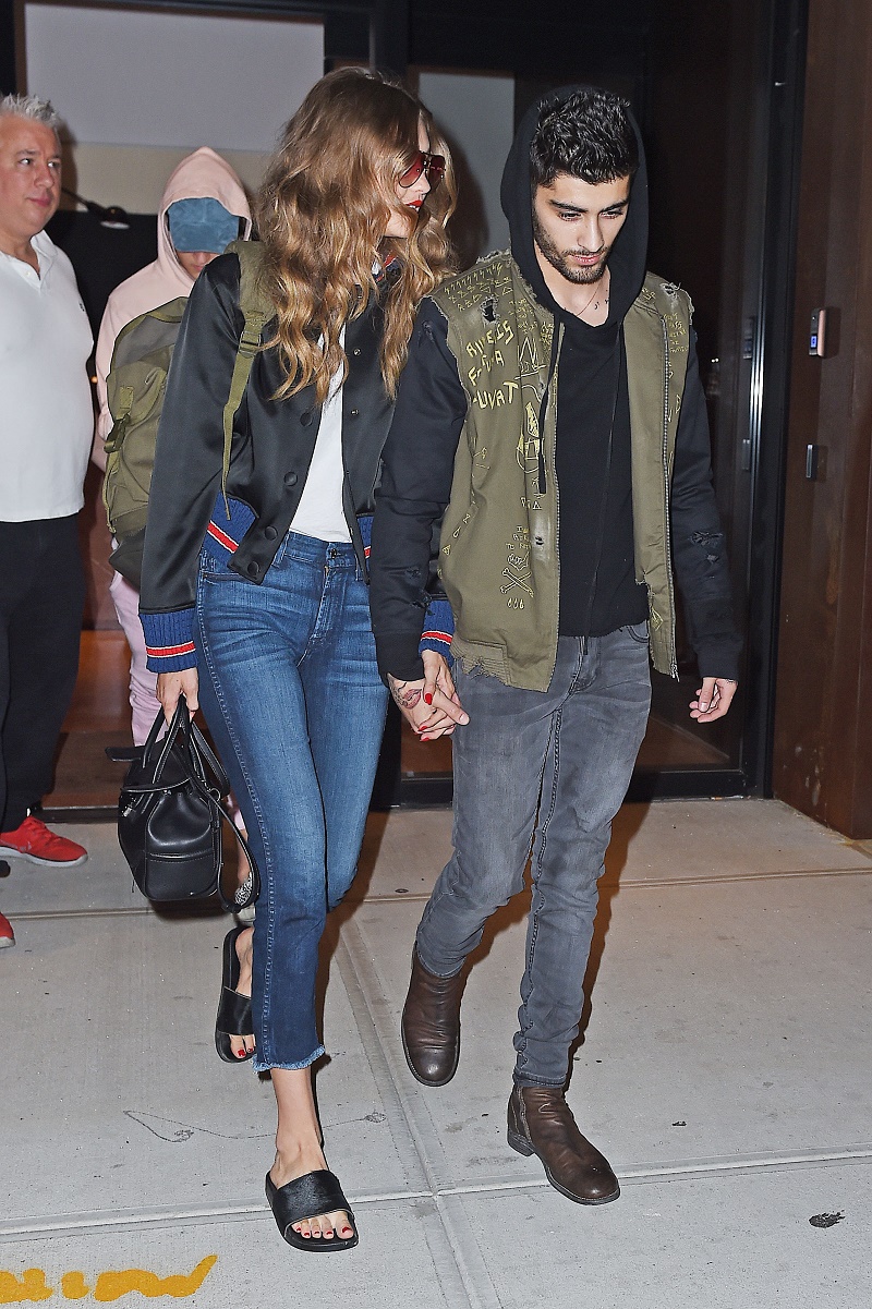 Matching Gigi Hadid and Zayn Malik hold hands as they head to the airport, NYC