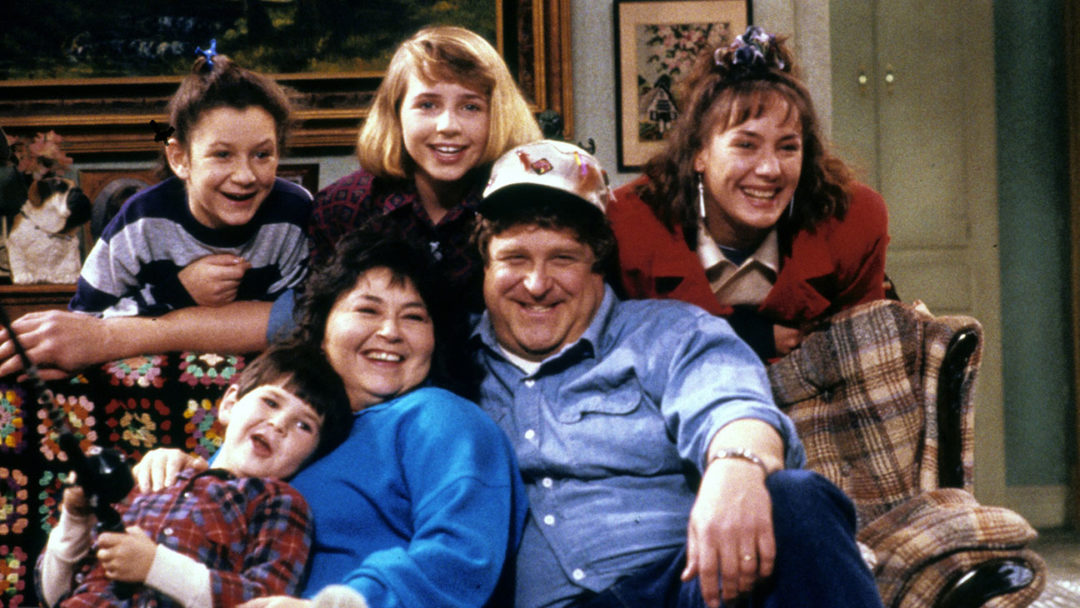 Roseanne (ABC) season 1 Fall 1988 Shown: [top] Sara Gilbert, Alicia Goranson, Laurie Metcalf [on sofa] Michael Fishman, Roseanne, John Goodman