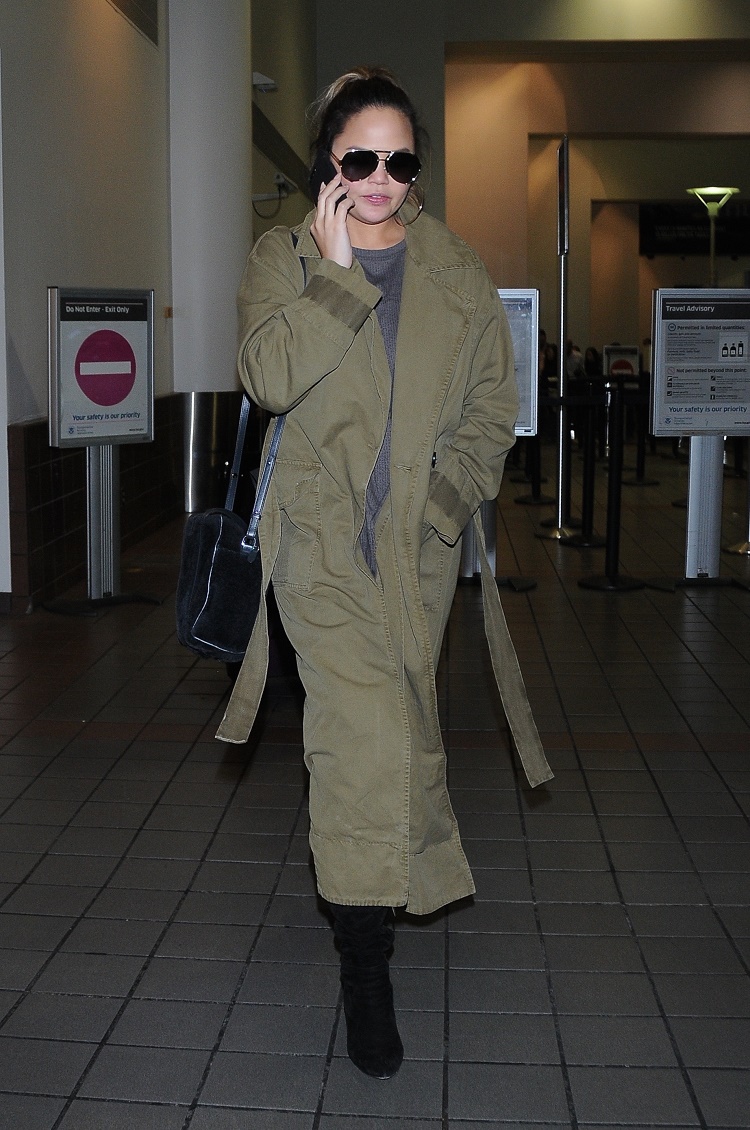 Chrissy Teigen is seen at LAX Airport in Los Angeles