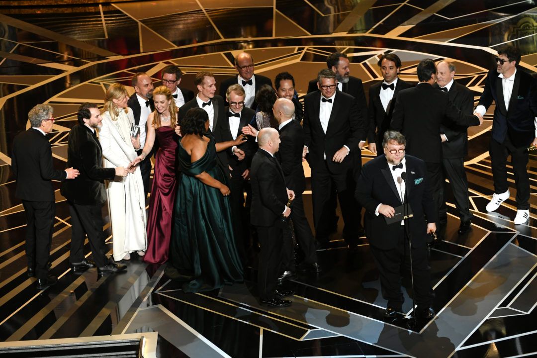 HOLLYWOOD, CA - MARCH 04: Producer J. Miles Dale (L), director Guillermo del Toro (at microphone) and cast/crew accept Best Picture for 'The Shape of Water' onstage during the 90th Annual Academy Awards at the Dolby Theatre at Hollywood & Highland Center on March 4, 2018 in Hollywood, California. (Photo by Kevin Winter/Getty Images)