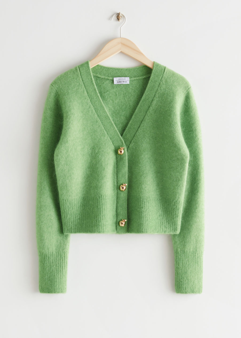 zeleni džemper s gumbima